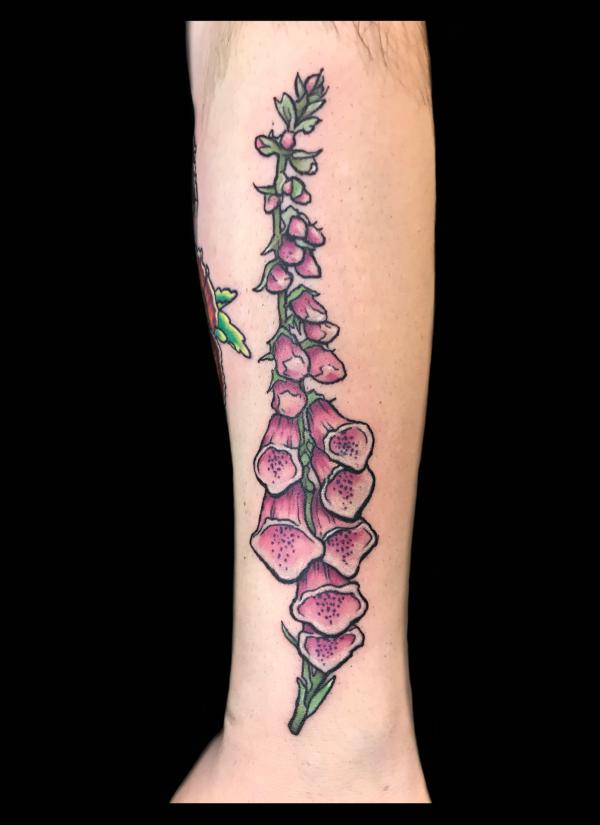 Traditional foxglove forearm tattoo