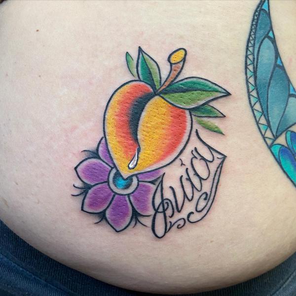 Traditional peach with flower tattoo