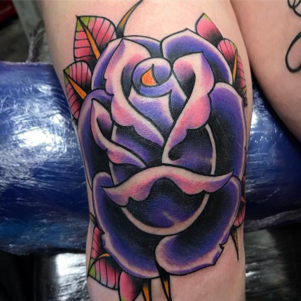 Traditional purple rose knee tattoo