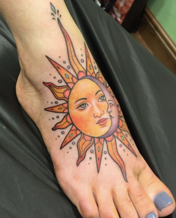 Traditional sun and moon foot tattoo