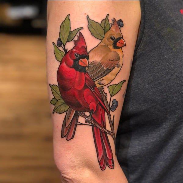 Two cardinal upper arm tattoo 1
