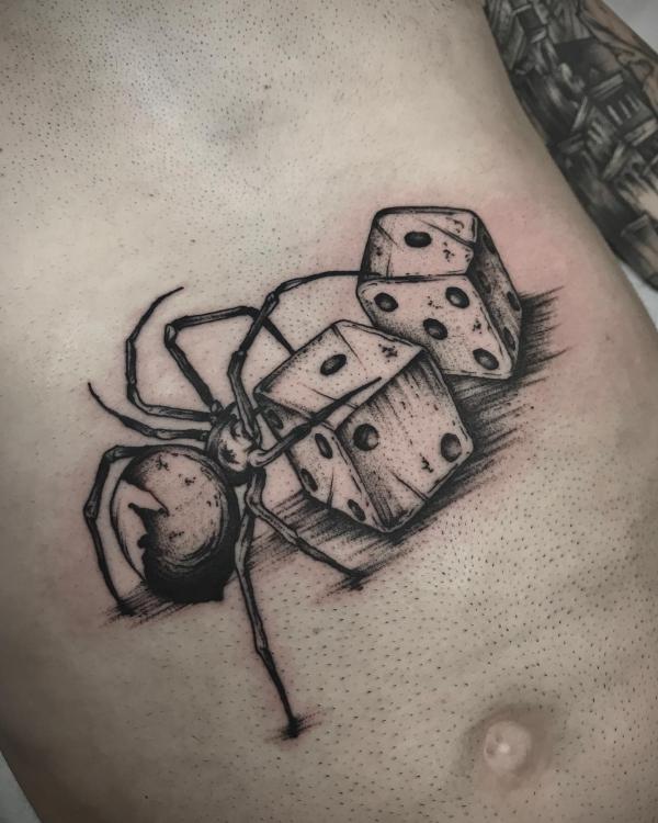 Two dices and spider tattoo