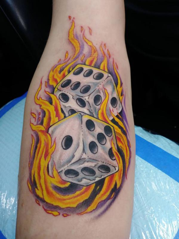 Two dices in fire tattoo