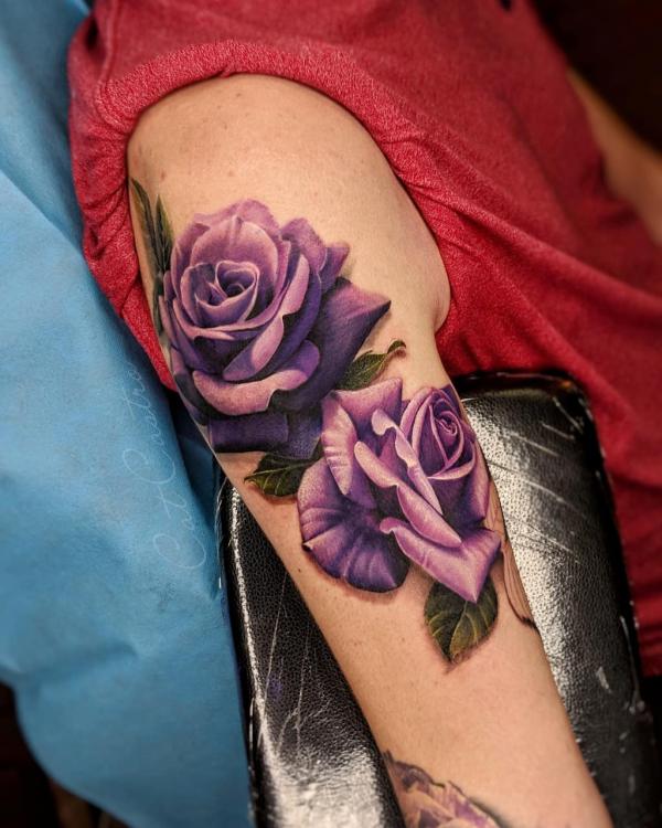 Two realistic purple rose sleeve tattoo