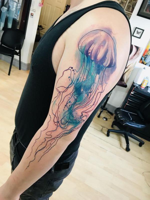 Watercolor and fine line jellyfish tattoo