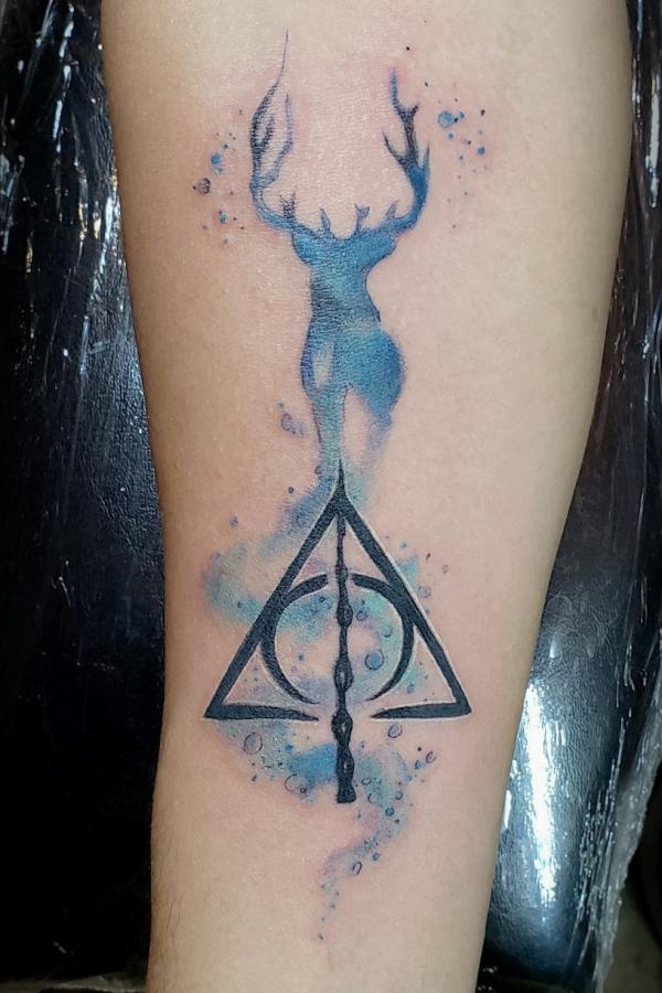 Watercolor deathly hallows and patronus stag tattoo