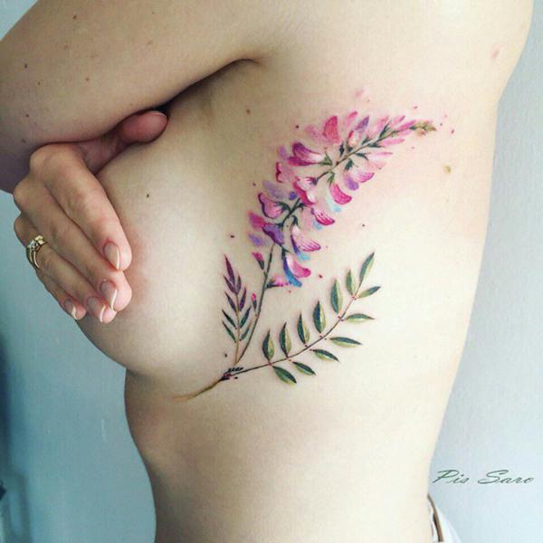 Watercolor leaves side boob tattoo