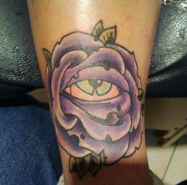 Wilted purple rose with eye