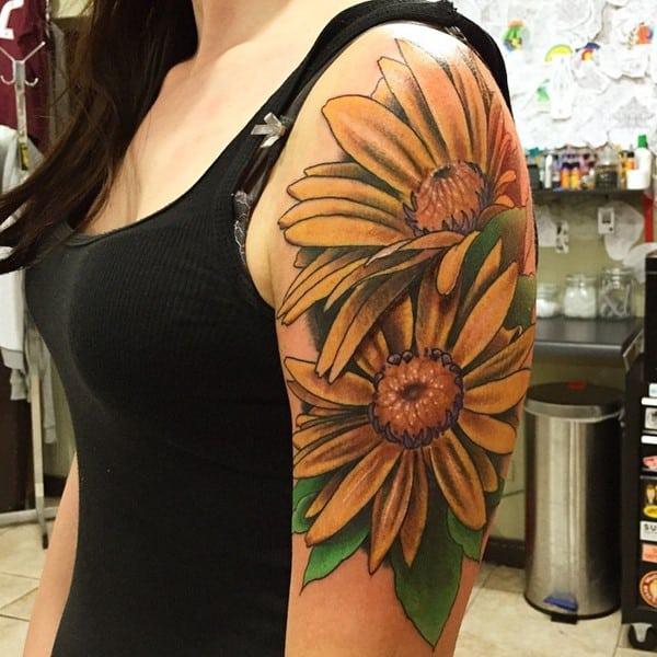 Yellow daisy tattoo