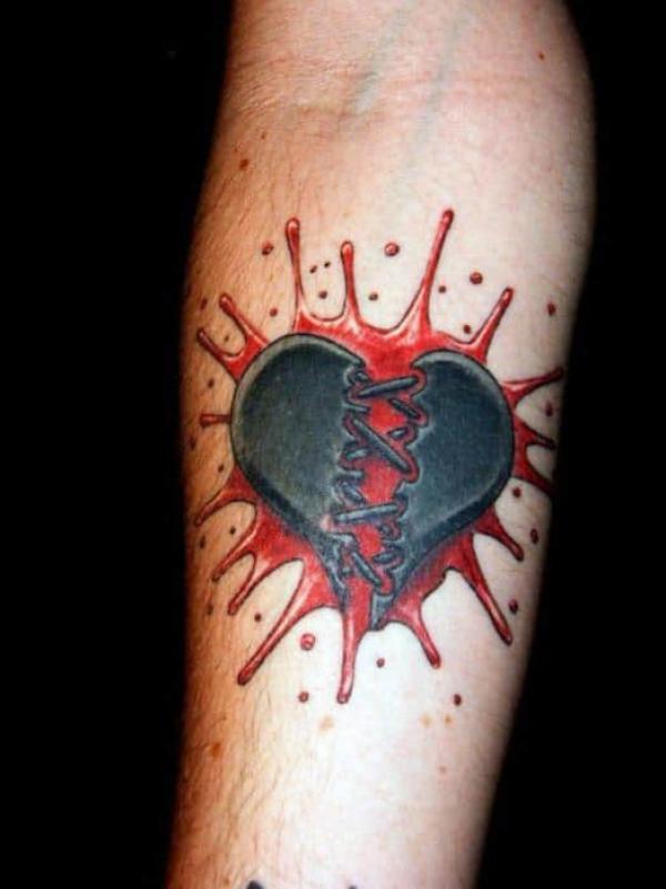 broken black heart and blood splatter tattoo