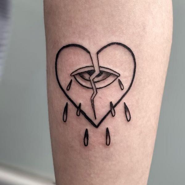 broken heart outline with eye and dripping tears tattoo