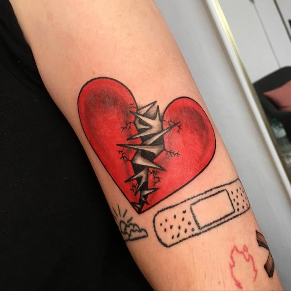 broken heart with bandaid and barbed wire tattoo