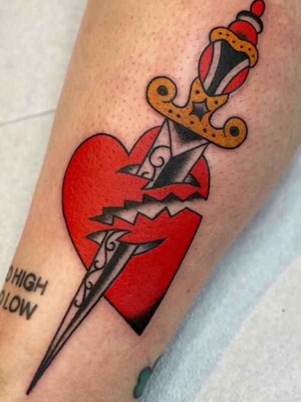 broken heart with dagger tattoo
