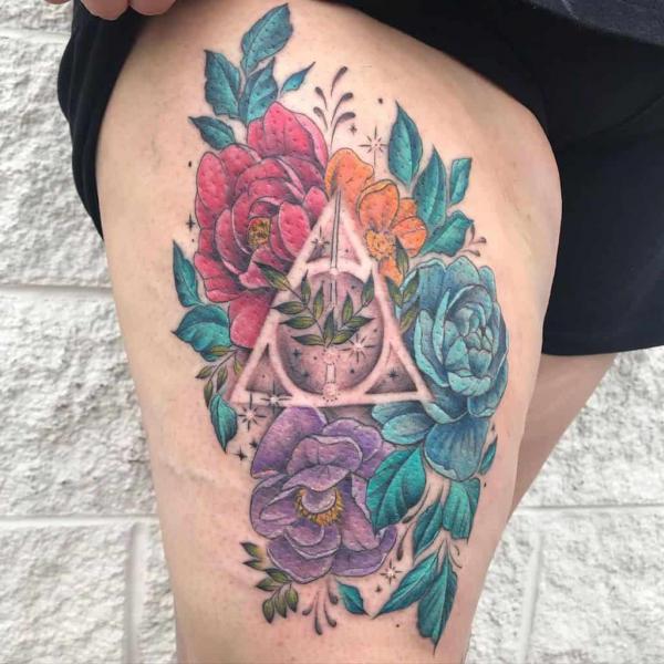 colorful floral deathly hallows thigh tattoo