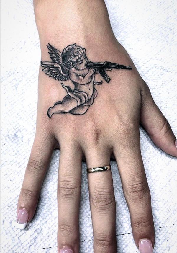 cupid hand tattoo