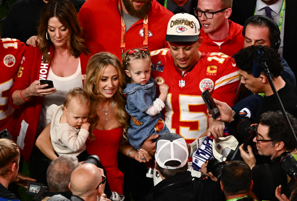 TOPSHOT - Kansas City Chiefs' quarterback #15 Patrick Mahomes with his wife Brittany Mahomes and their children Patrick Bronze and Sterling Skye celebrate winning Super Bowl LVIII against the San Francisco 49ers at Allegiant Stadium in Las Vegas, Nevada, February 11, 2024. (Photo by Patrick T. Fallon / AFP) (Photo by PATRICK T. FALLON/AFP via Getty Images)