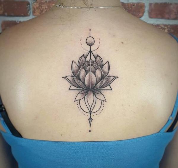 deathly hallows and lotus back tattoo