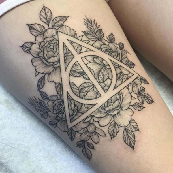 deathly hallows and peonies thigh tattoo