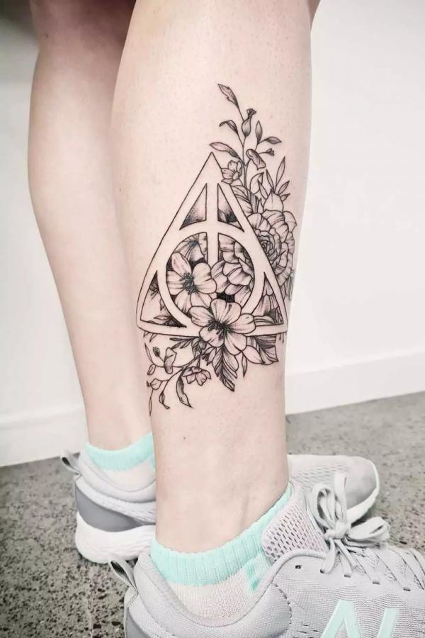 harry potter death hallows with flowers tattoo