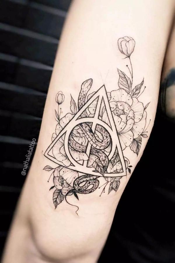 harry potter deathly hallows with snake and peonies tattoo