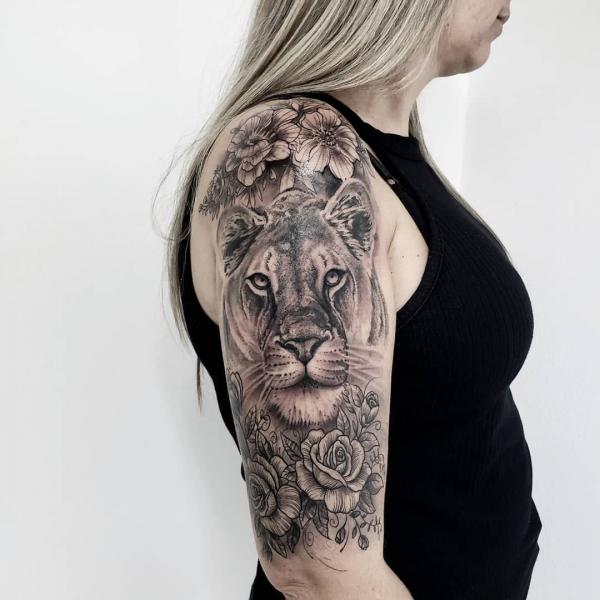 leo lioness half sleeve tattoo