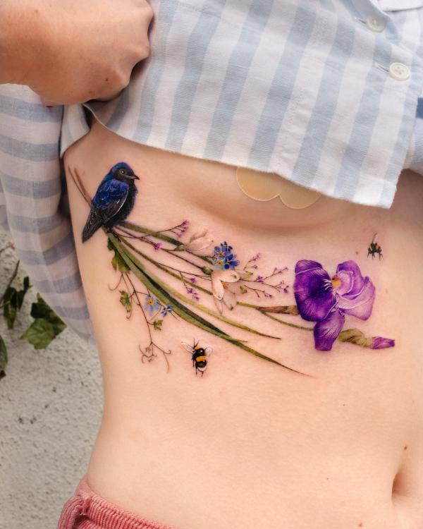 martin bird and purple iris bees side boob tattoo