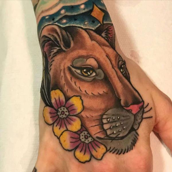 neo traditional lioness hand tattoo