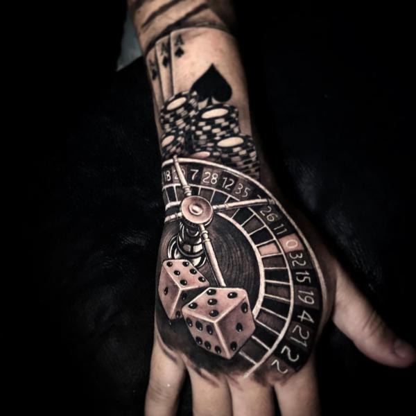 roulette wheel with dices tattoo hand