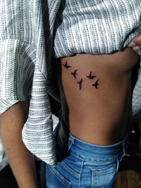 silhouette birds side boob tattoo
