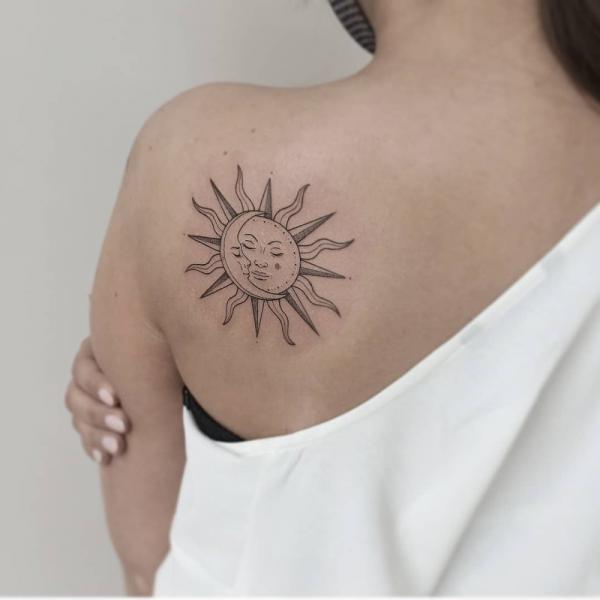 sun and moon shoulder blade tattoo