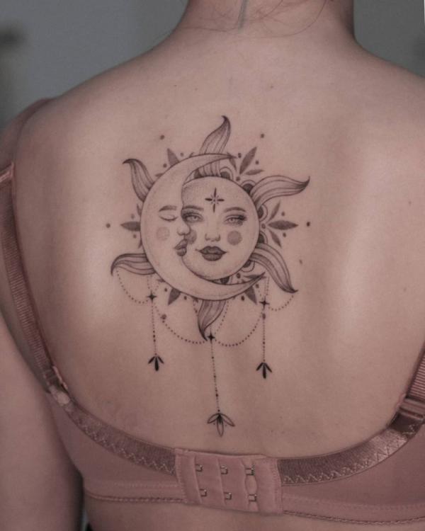 sun and moon smiling face back tattoo
