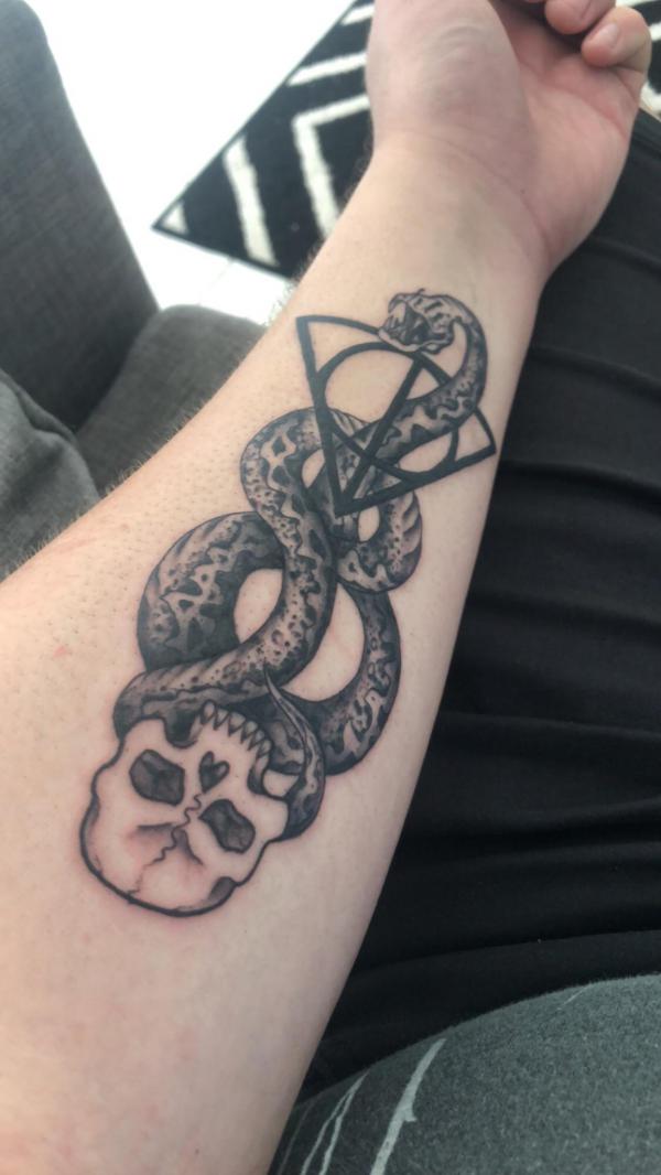the dark mark and deathly hallows forearm tattoo
