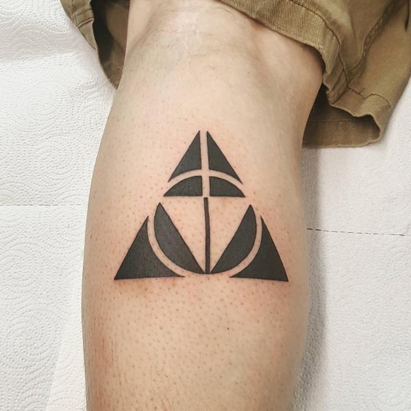 triforce and deathly hallows calf tattoo
