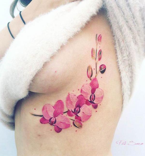watercolor pink orchid side boob tattoo