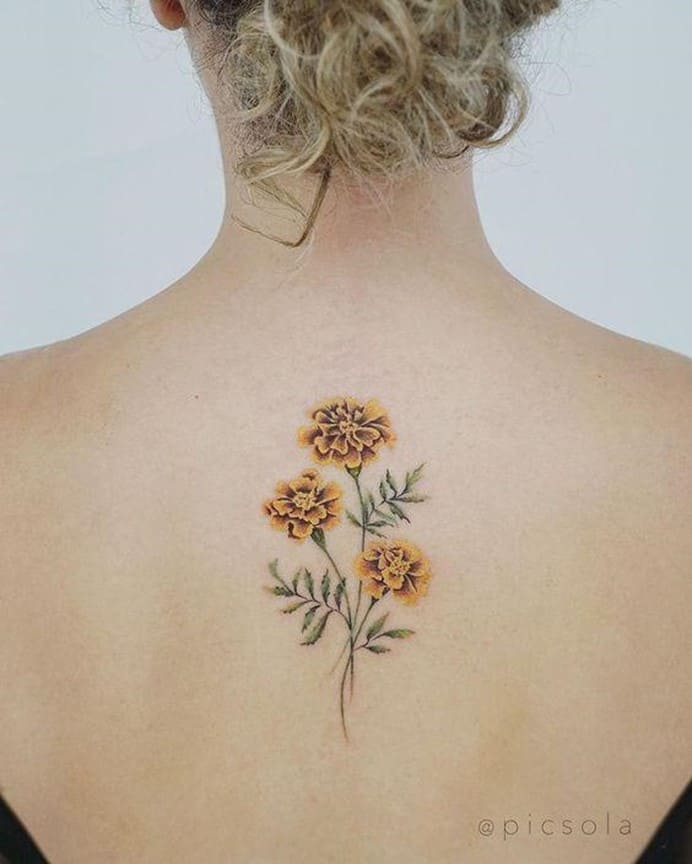 Small Yellow Flower Tattoo Over Back