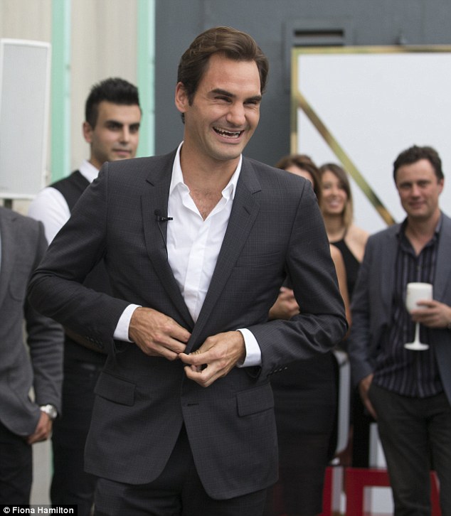 Suave: Roger cut a handsome figure as he arrived at the event in a dark grey suit which he teamed with a crisp white shirt