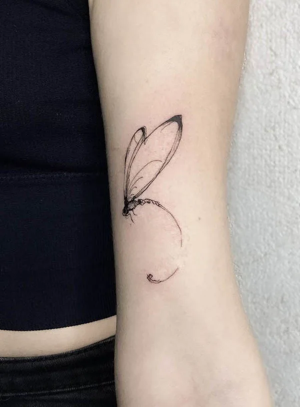 Abstract dragonfly tattoo by @koon.tattoo