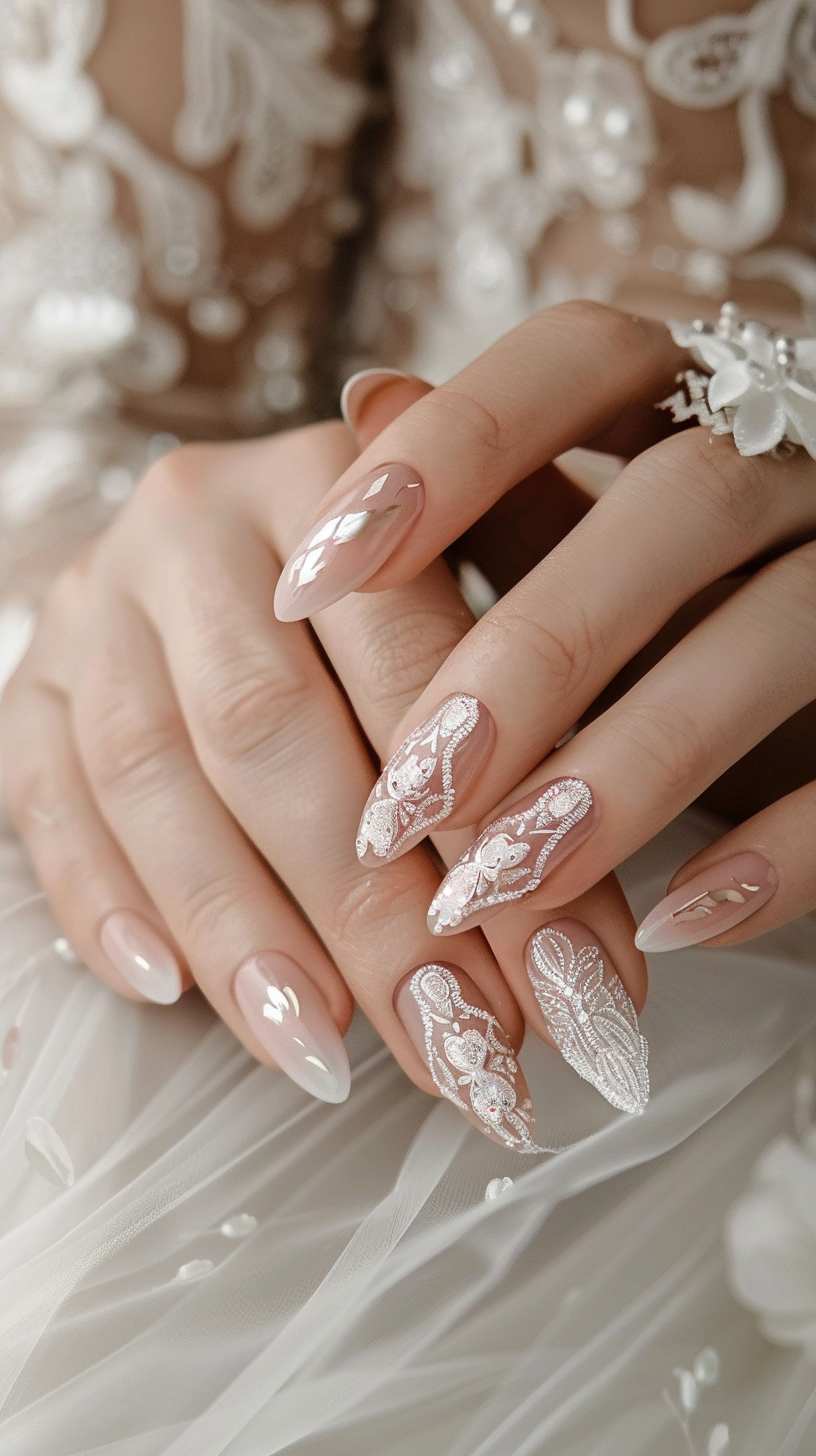These bridal nails showcase an intricate lace design in white, delicately painted on a sheer nude base. The ornate patterns mimic the look of vintage lace, creating a sophisticated and romantic aesthetic perfect for a wedding day.