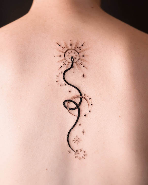 Stunning black snake back tattoo by @norangtattoo