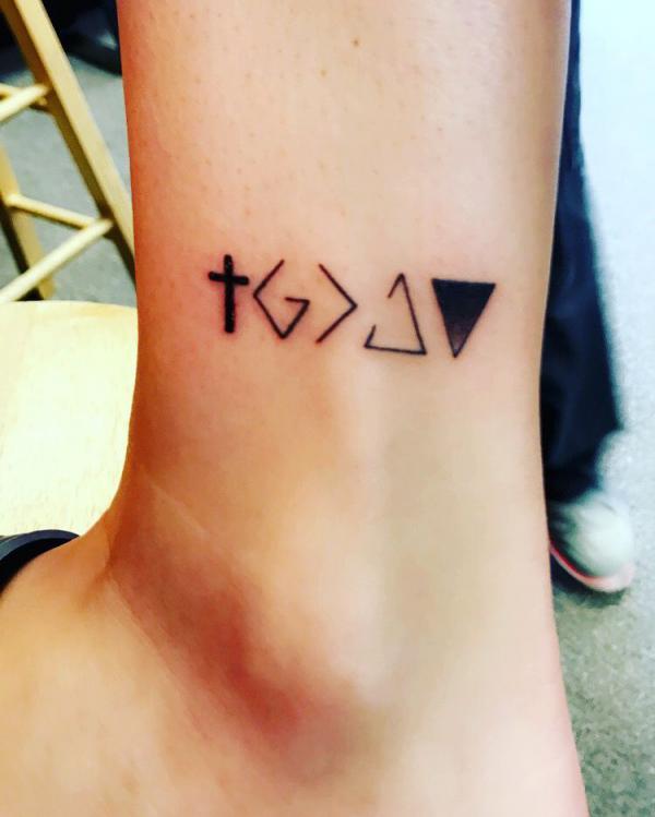 Cross and god is greater than the highs and lows ankle tattoo