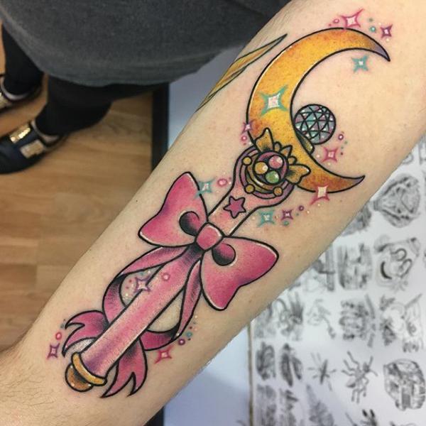 Forearm sailor moon wand with bow tattoo