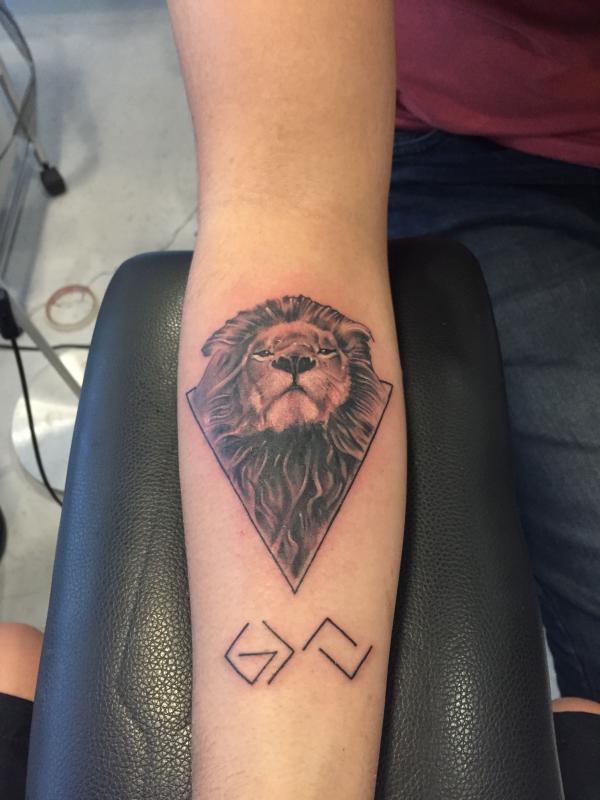 Lion king and god is greater than the highs and lows forearm tattoo