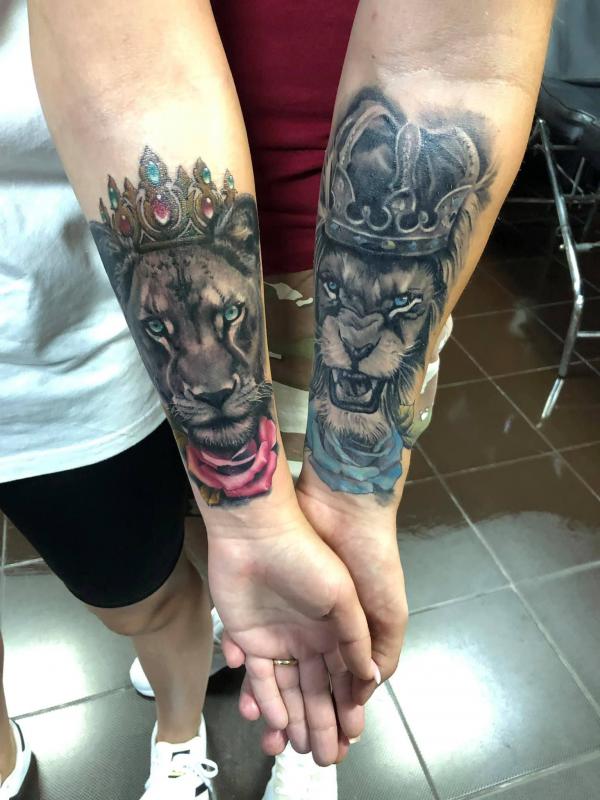 Lion king with blue rose and green with red rose tattoo forearm