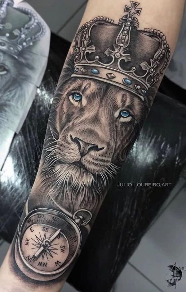 Lion king with crown and compass tattoo