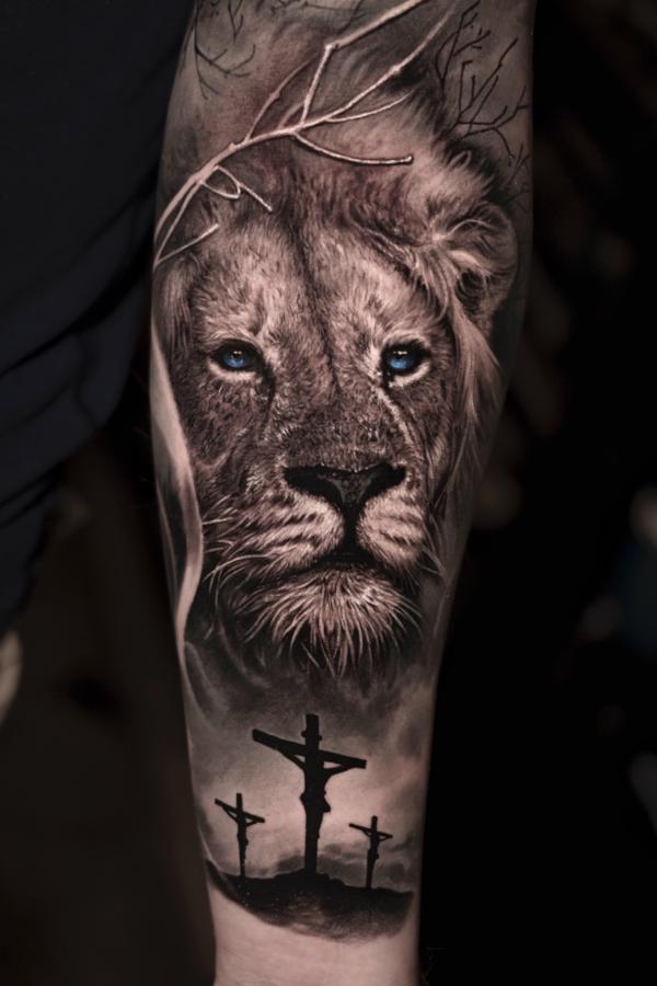 Lion king with three crosses tatoo forearm