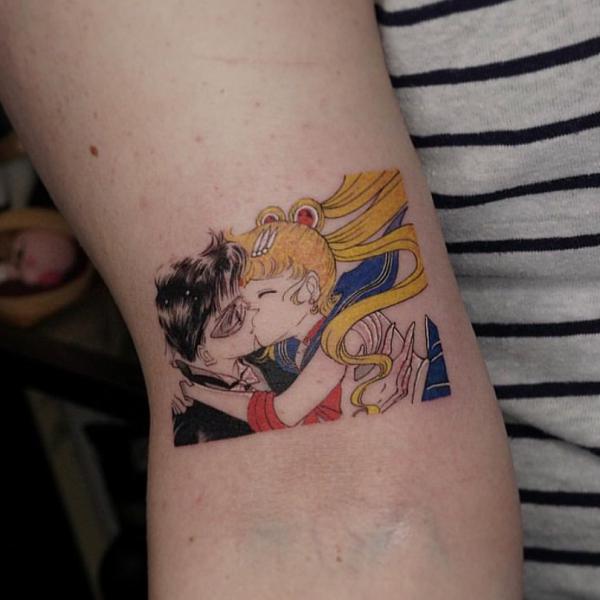 Sailor Moon and Tuxedo Mask arm tattoo