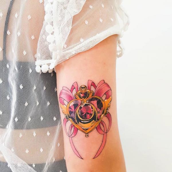 Sailor moon crisis back of arm tattoo