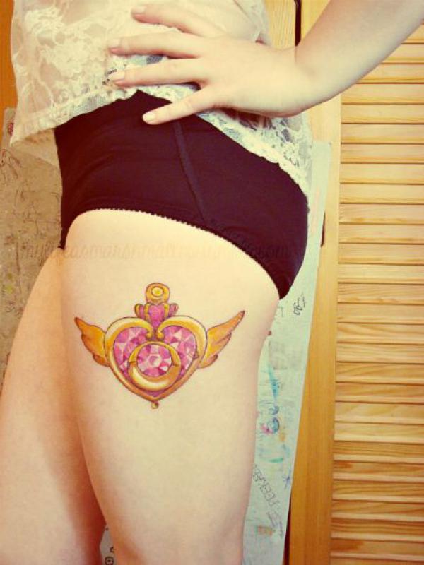 Sailor moon crisis brooch tattoo on thigh