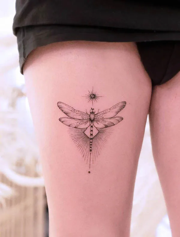 Sun and dragonfly thigh tattoo by @fda__lights