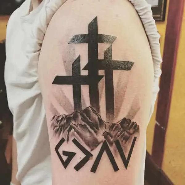 Three cross and god is greater than the highs and lows half sleeve tattoo